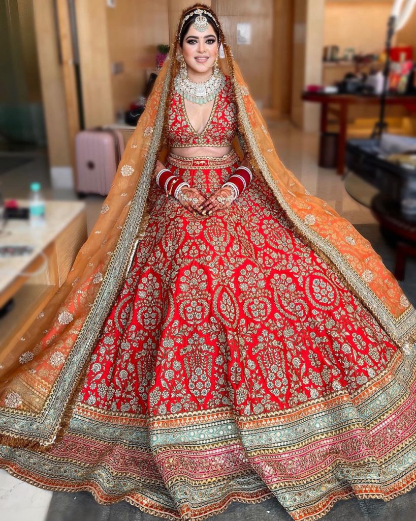 red and orange lehenga